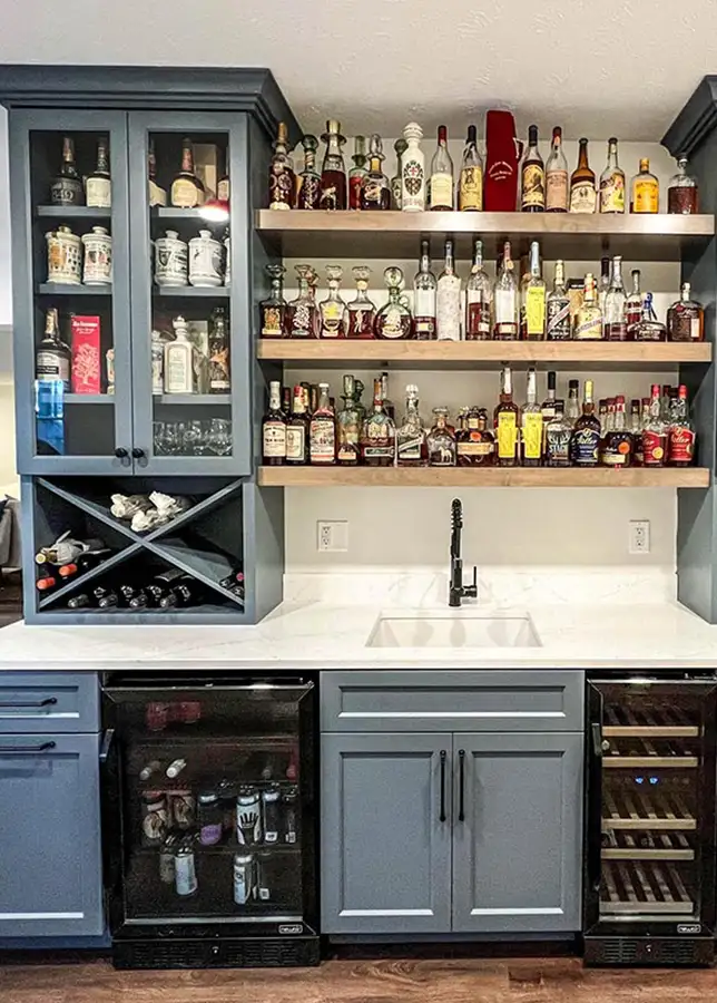 dark teal custom cabinetry for fully stocked wet bar | Eureka, IL
