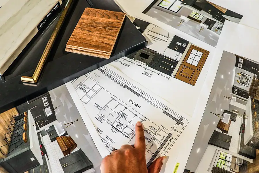 Gravel Lane Design Studio - designer pointing out specifics in custom kitchen schematics - Eureka, IL