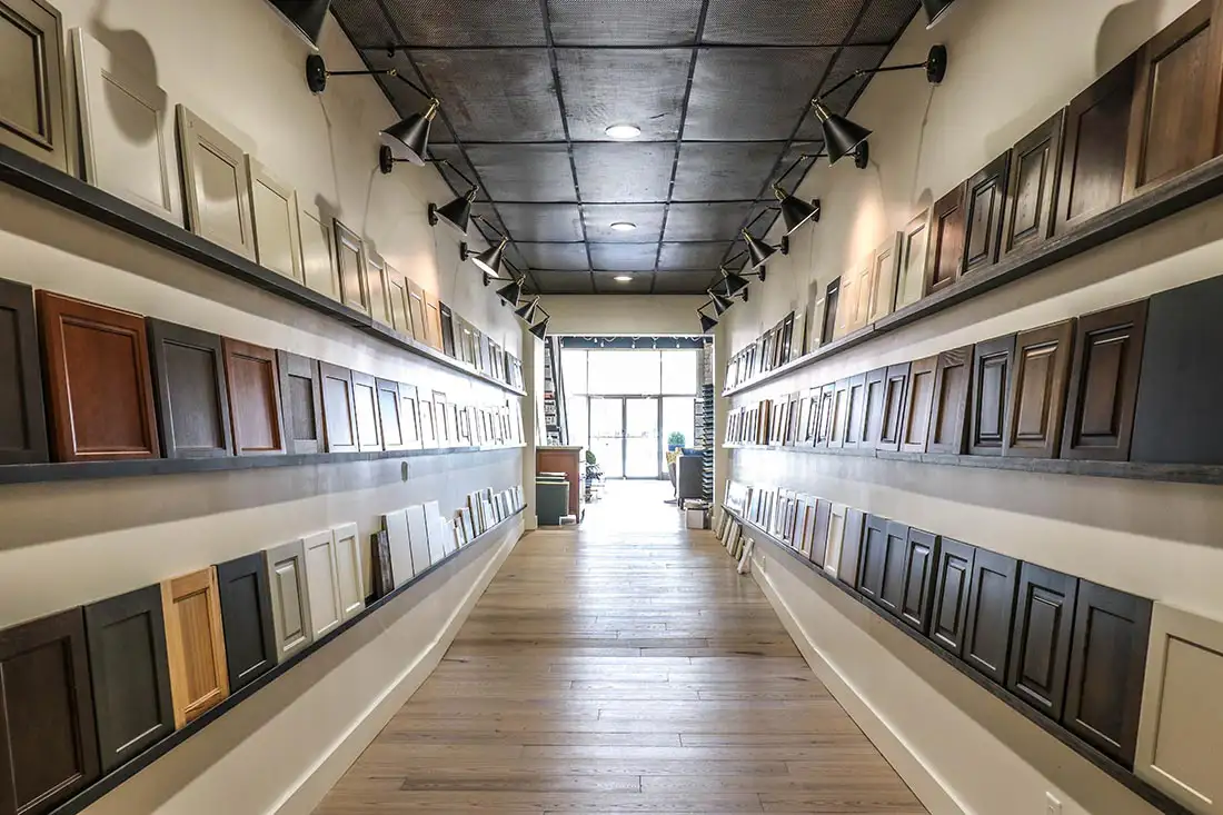 Inside Gravel Lane Design Studio showroom, display of cabinet finish options | Eureka, IL