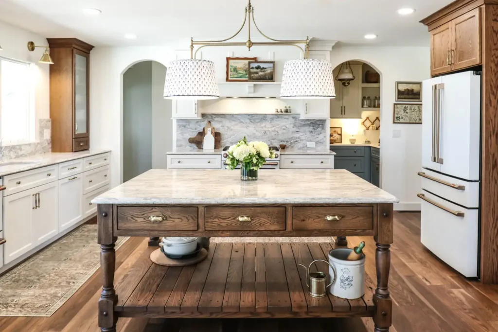 GRAVEL LANE DESIGN - Mixing Old & New: A Tour of This Charming Home Remodel - beautiful remodel of a kitchen with a large island in the center