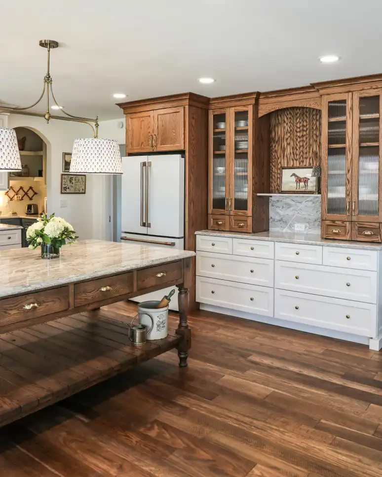 GRAVEL LANE DESIGN - Mixing Old & New: A Tour of This Charming Home Remodel - beautiful cabinets and a fridge next to a large kitchen island