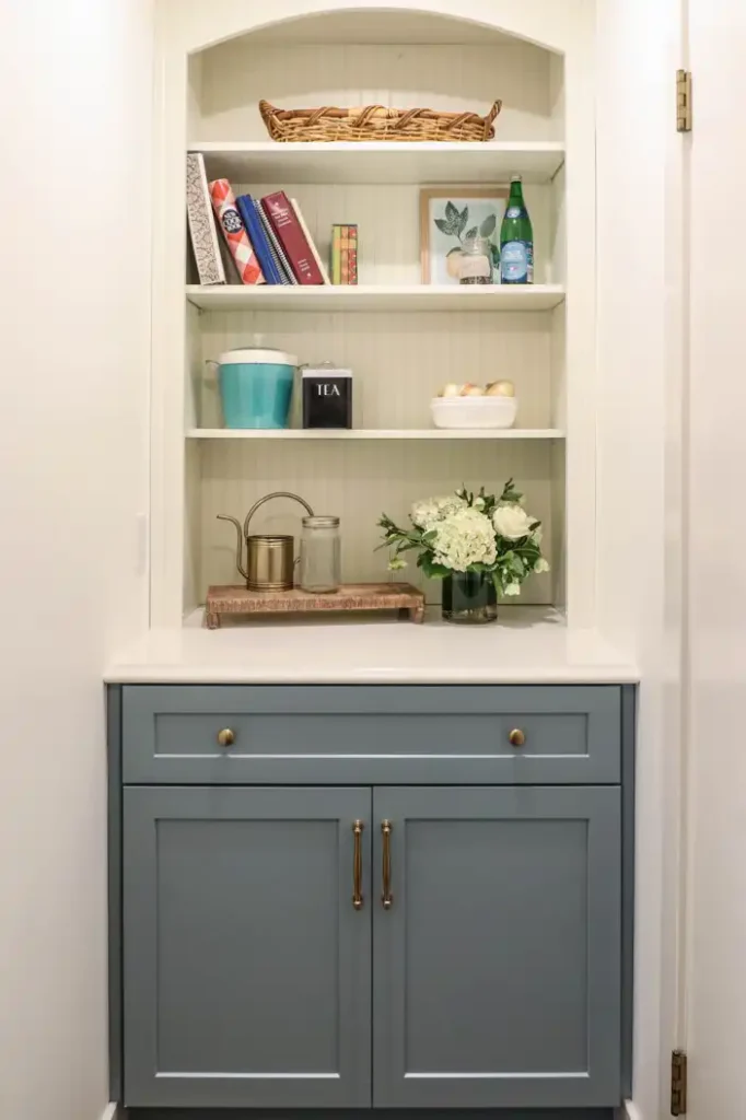 GRAVEL LANE DESIGN - Mixing Old & New: A Tour of This Charming Home Remodel - beautiful remodel of a kitchen with blue cabinets and a arched shelving space