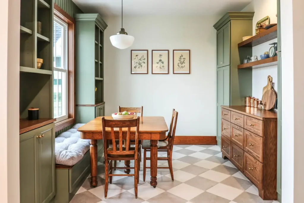 GRAVEL LANE DESIGN - Interior Design Principles and How to Apply Them to Your Home: A beautiful dining area with tall green cabinets and bookshelves.